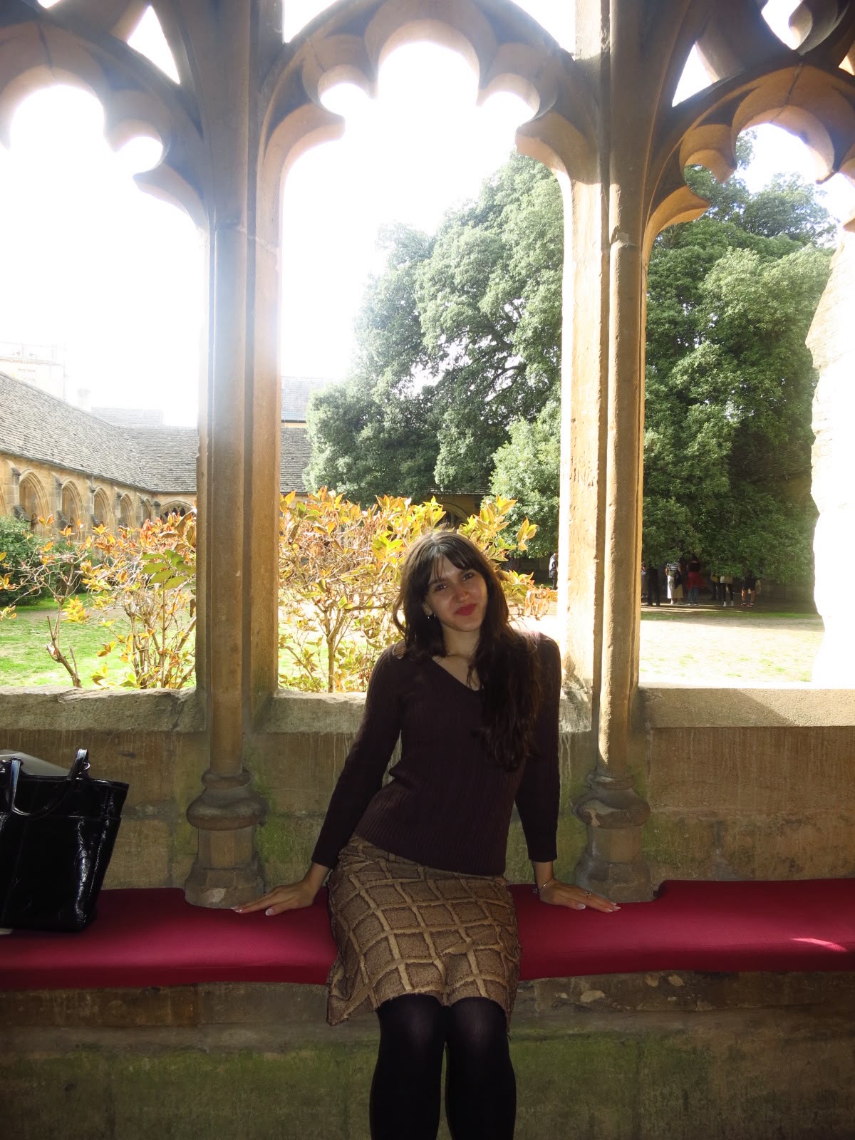 An image of the website developer sitting at the cloisters in Oxford.